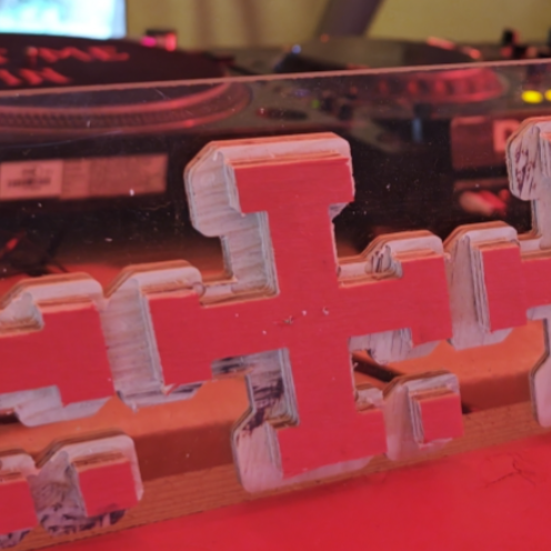 cross on dj booth